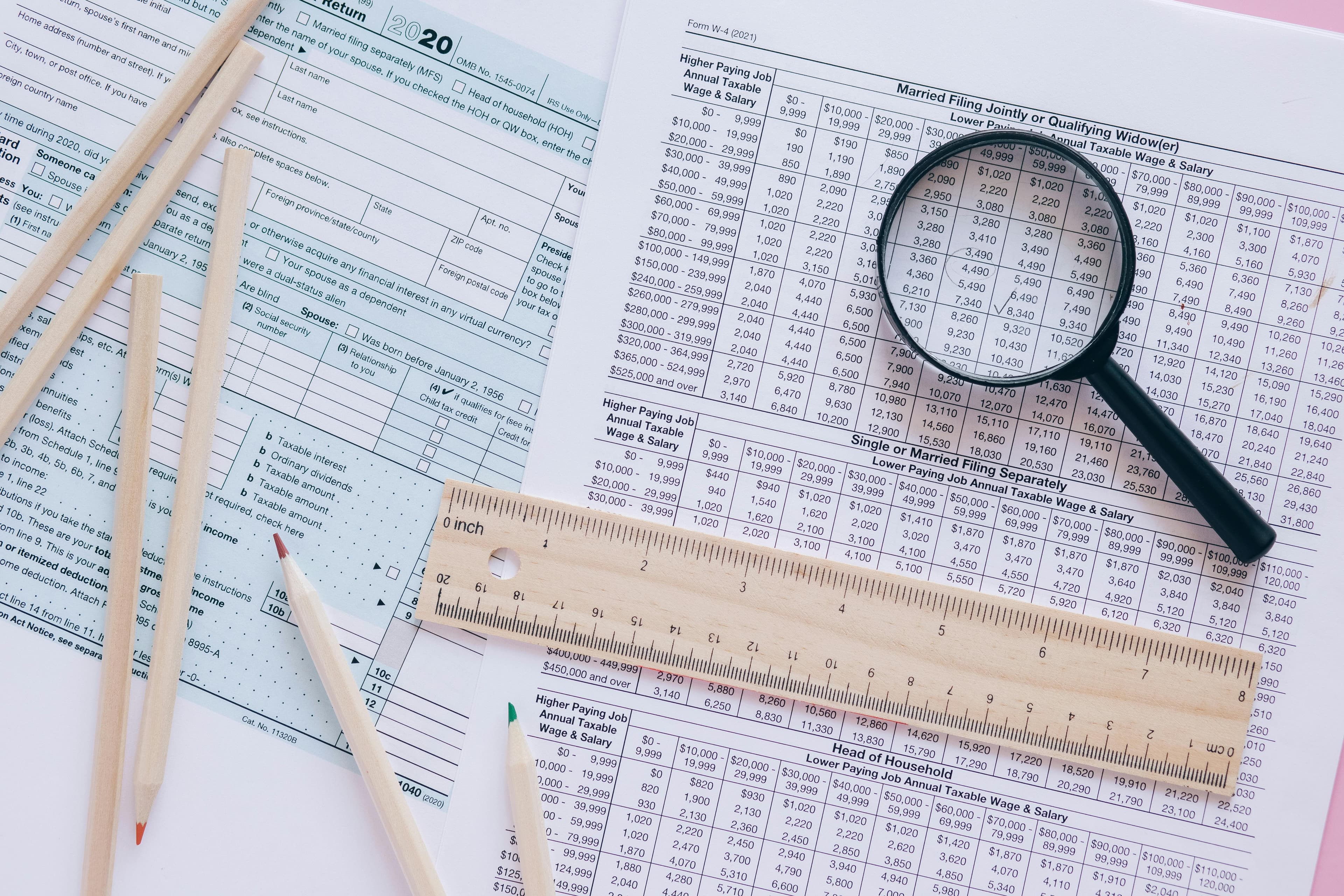 Papers and magnifying glass.