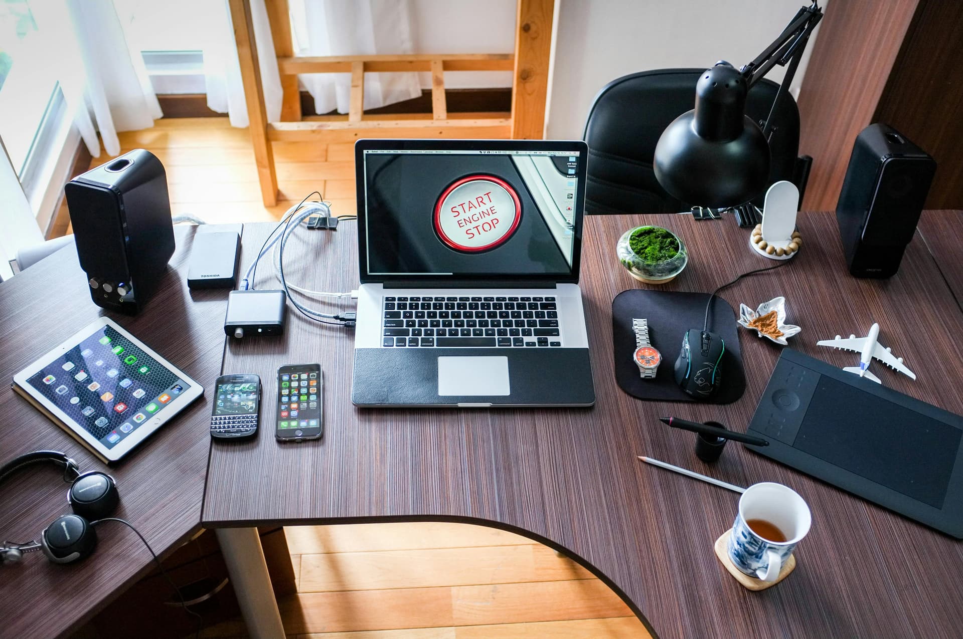 Work desk with computer, tablet and other equipments.