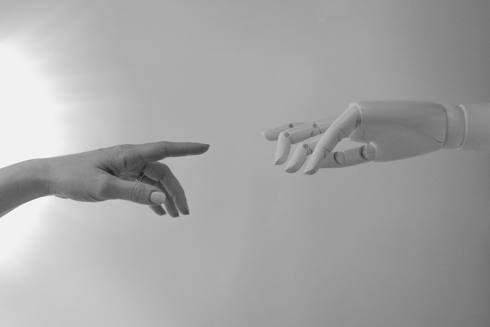 Human hand and robot hand.