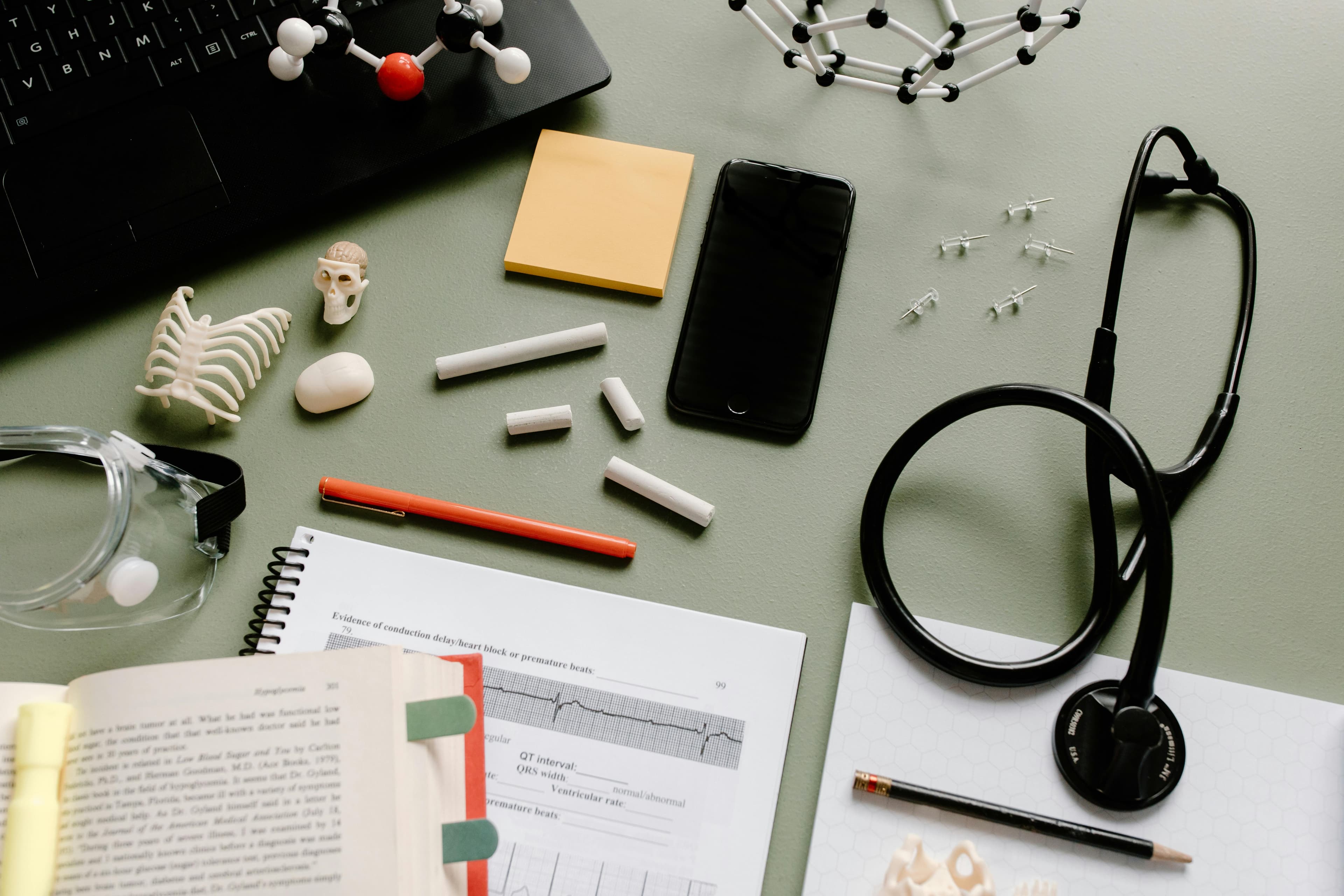 Medical equipment, samples and documents on desk.