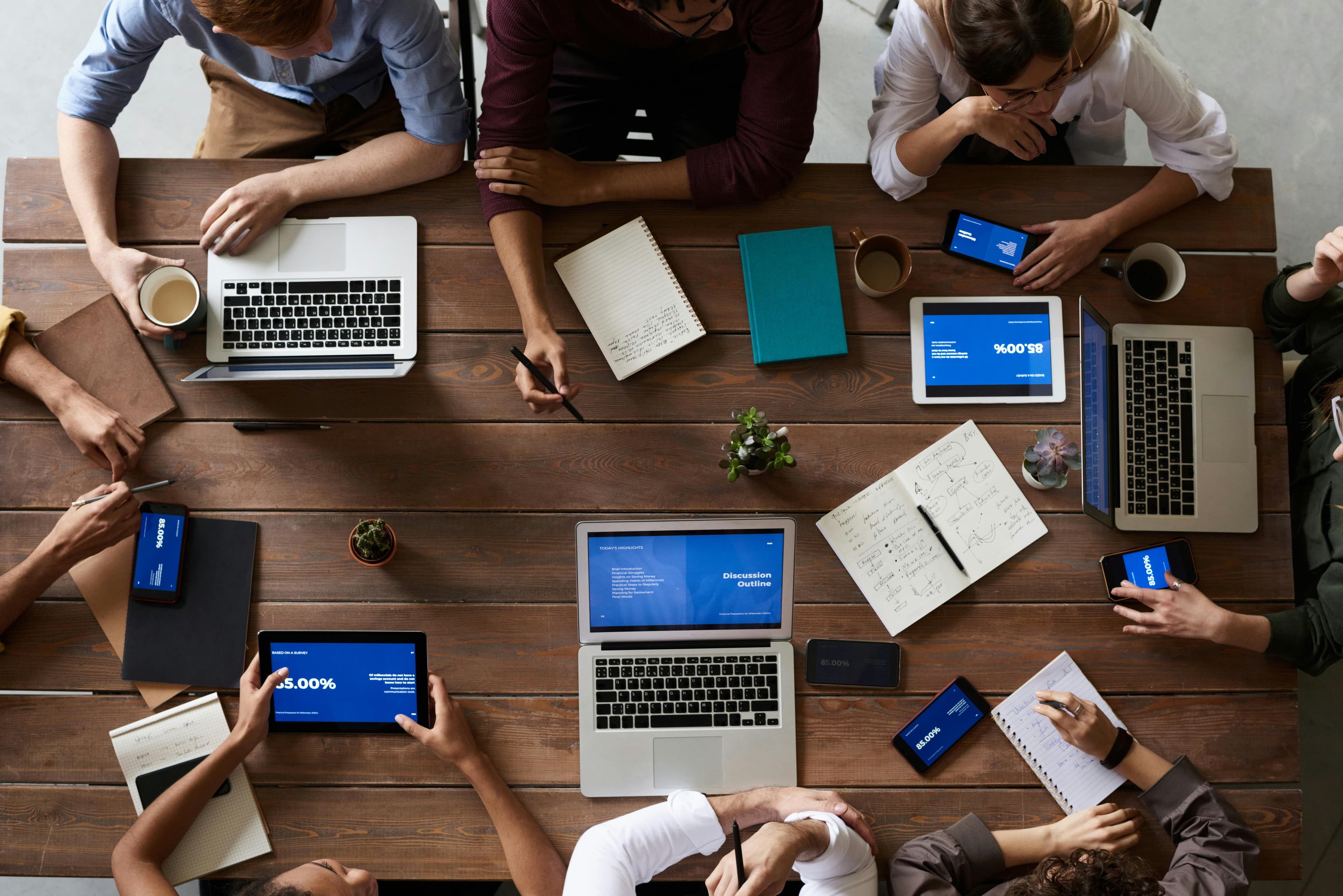 Team members sat at an office table.